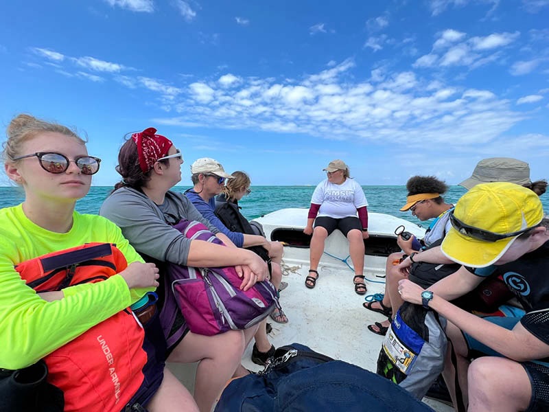 Ecology students researching on boat in Bahamas