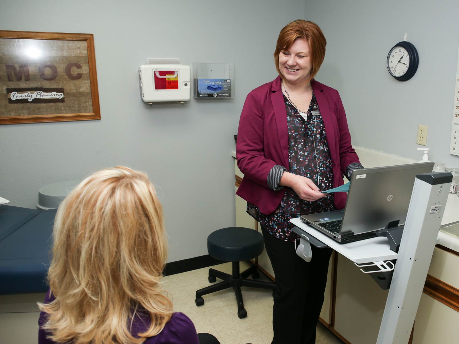 nurse talking to patient